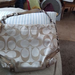 Tan colored coach bag